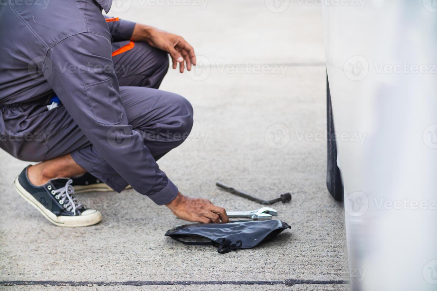 Technicians from service center inspect and assist customers cars that are having problems while traveling build confidence in customers who choose buy car from service center and receive help quickly photo