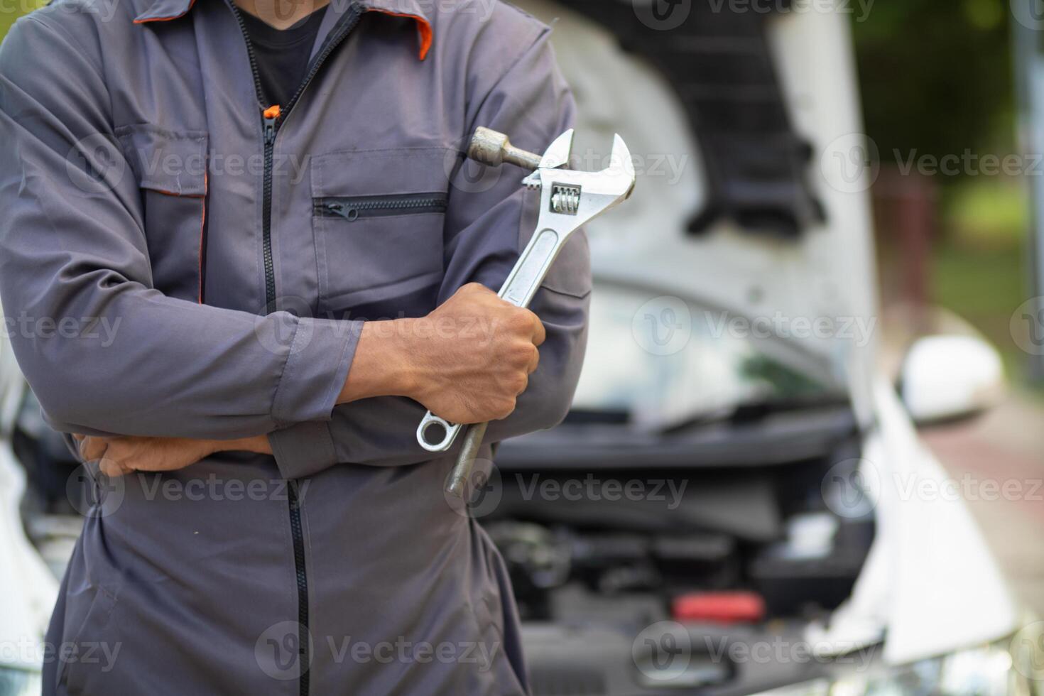 Technicians from service center inspect and assist customers cars that are having problems while traveling build confidence in customers who choose buy car from service center and receive help quickly photo
