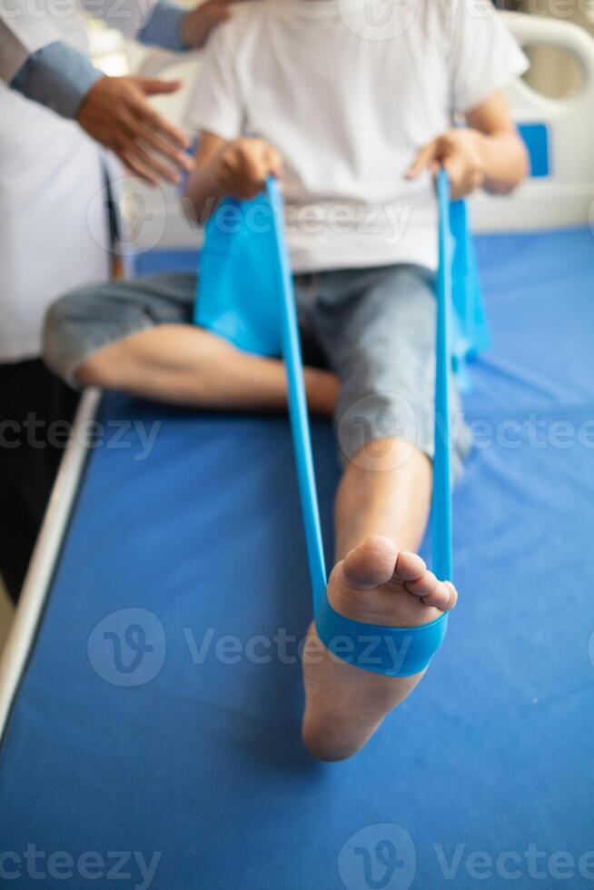 Doctors are examining patient muscle injuries and doing physical therapy for patient to move muscles so they can be used regularly because physical therapy will help strengthen muscles and blood flow. photo