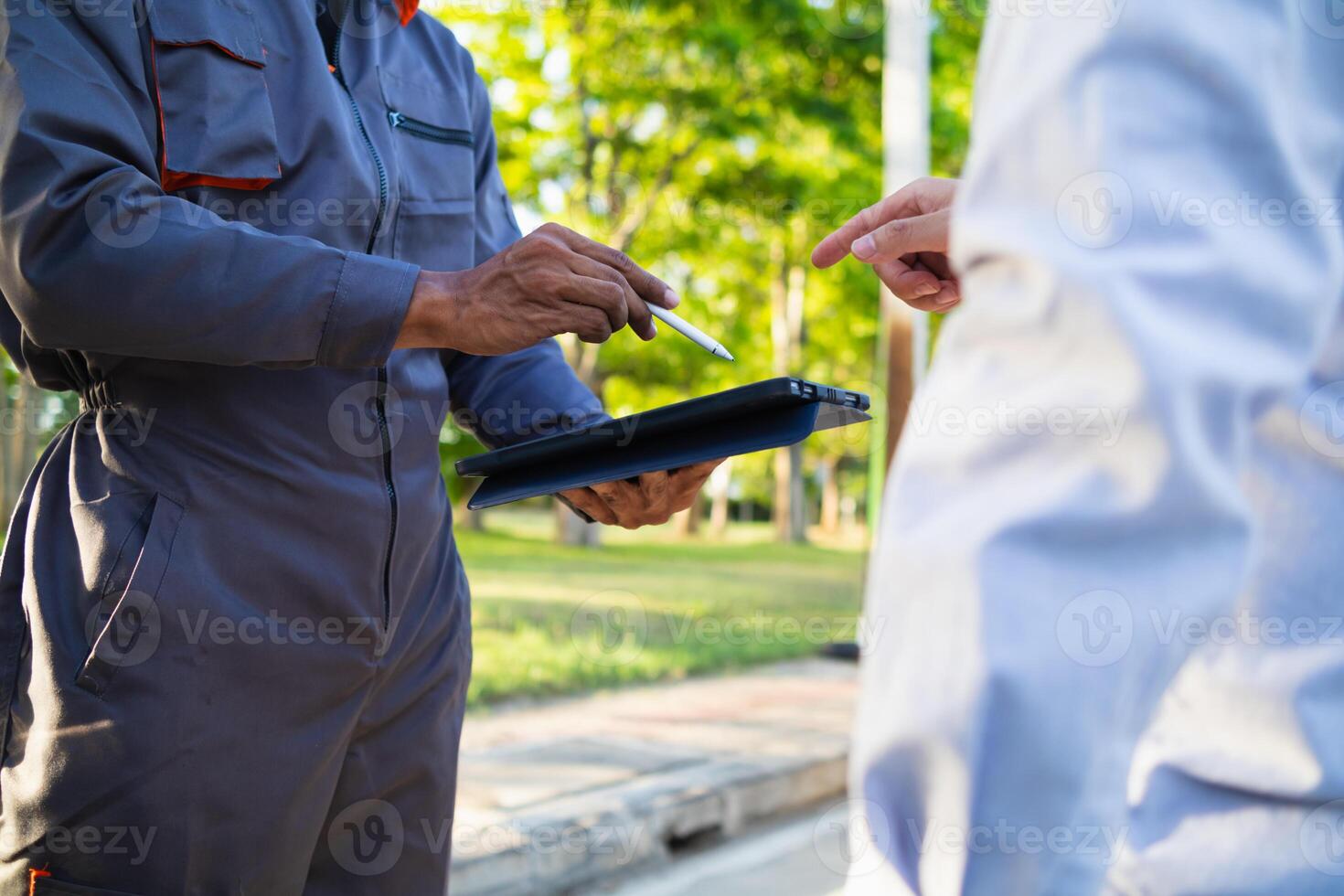 Technicians from service center inspect and assist customers cars that are having problems while traveling build confidence in customers who choose buy car from service center and receive help quickly photo