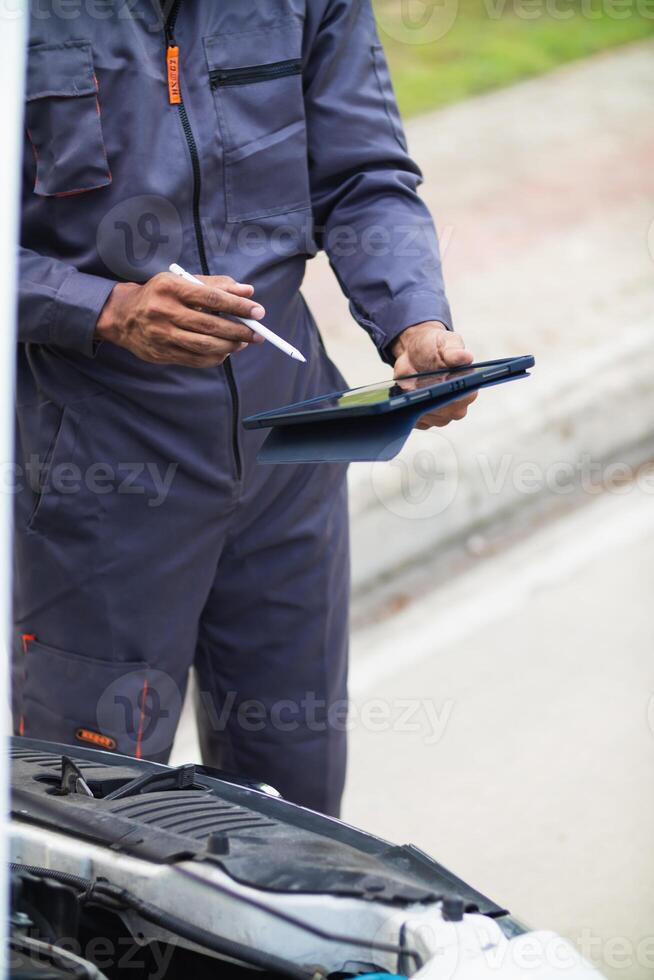 car service center mechanics are checking condition car and engine make sure they are ready use and in perfect condition according center warranty. periodic vehicle inspections for safety in driving. photo