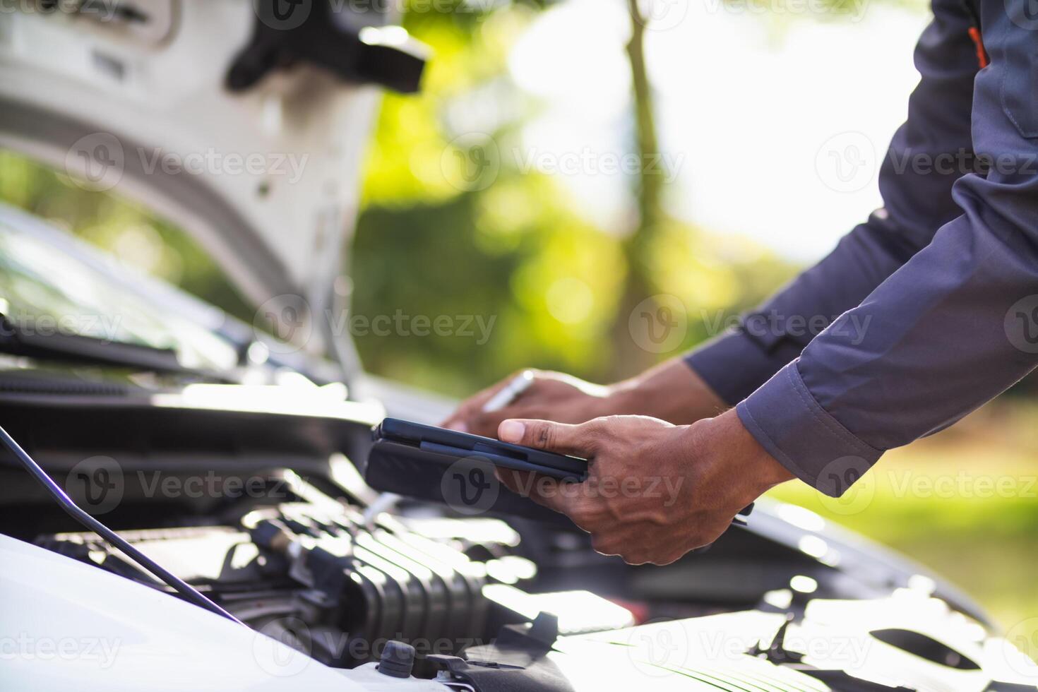 car service center mechanics are checking condition car and engine make sure they are ready use and in perfect condition according center warranty. periodic vehicle inspections for safety in driving. photo