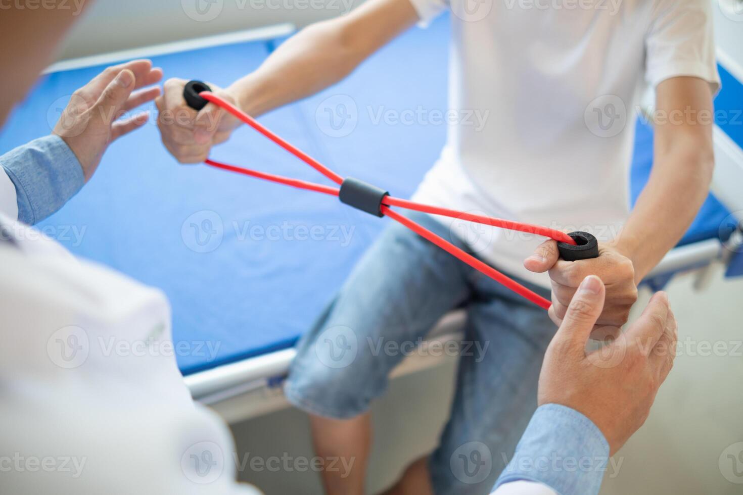 doctor is examining muscle injury and using elastic bands test injury and also help with physical therapy strengthen muscles because physical therapy will help strengthen muscles and help blood flow. photo