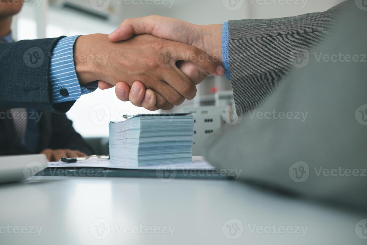 Real estate brokers offer attractive promotions customers so they can decide purchase condominium unit for living and as value added asset. Concept of signing real estate purchase contract with dealer photo