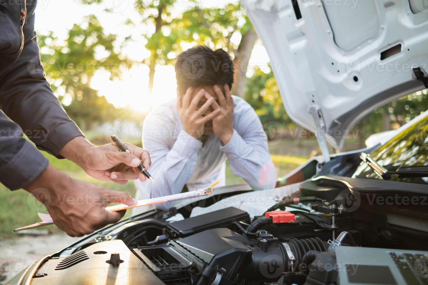 Technicians from service center inspect and assist customers cars that are having problems while traveling build confidence in customers who choose buy car from service center and receive help quickly photo