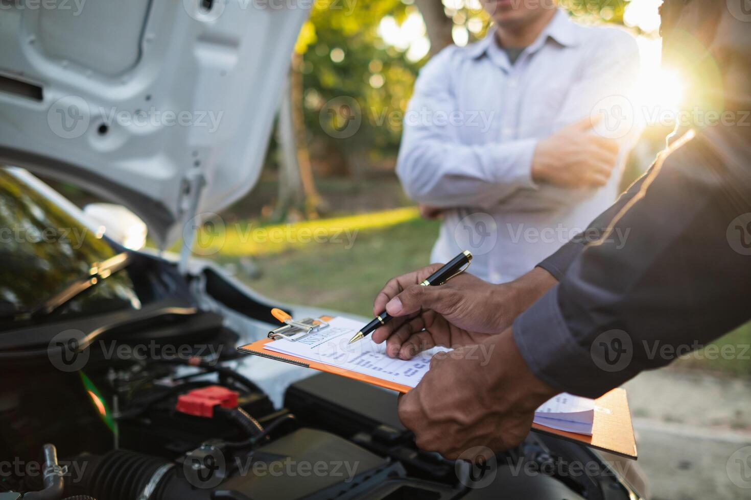 car service center mechanics are checking condition car and engine make sure they are ready use and in perfect condition according center warranty. periodic vehicle inspections for safety in driving. photo