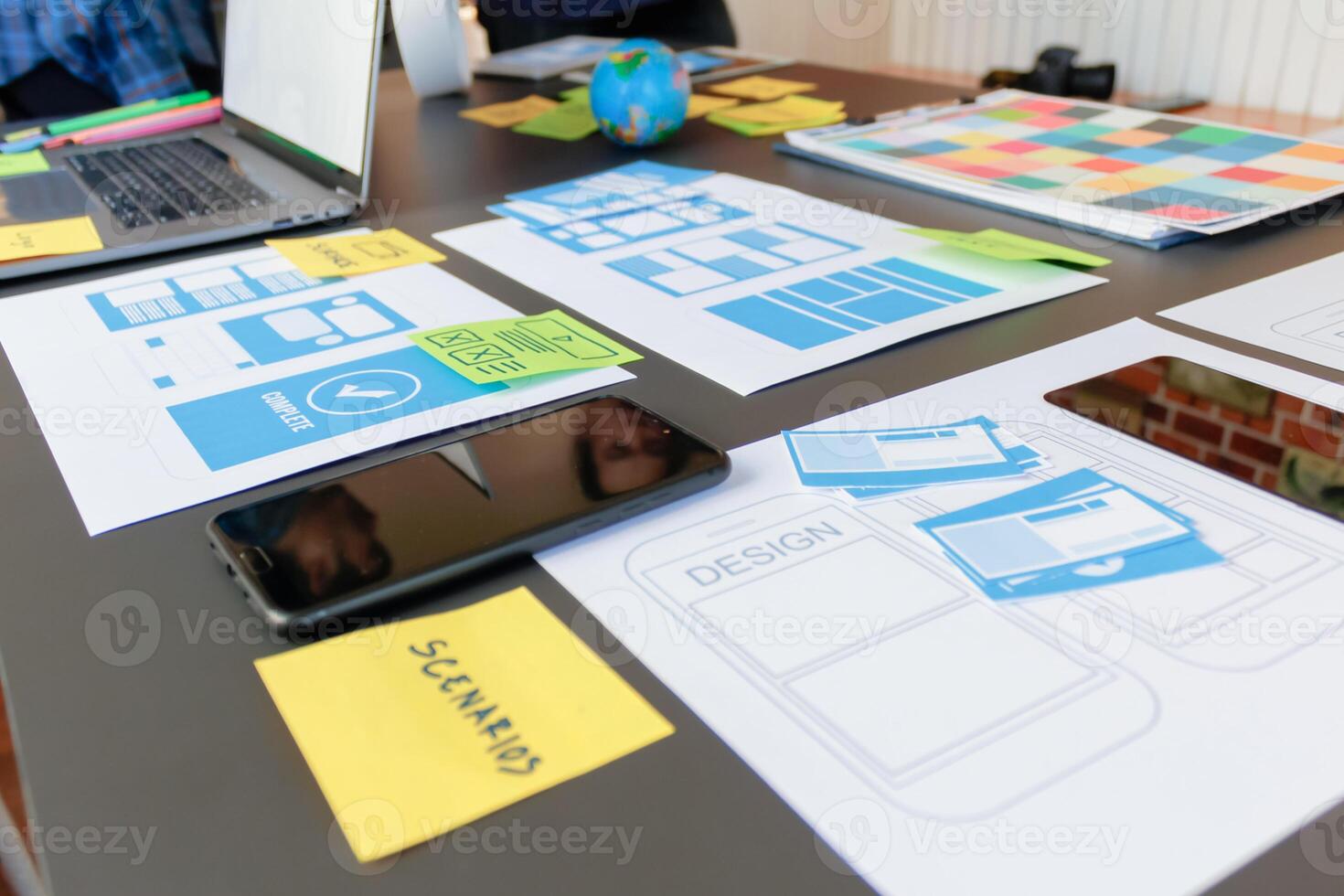 mobile application development team is studying and designing ux ui system to display and color in application on smartphone to work efficiently and not cause the ux ui system to have any errors. photo