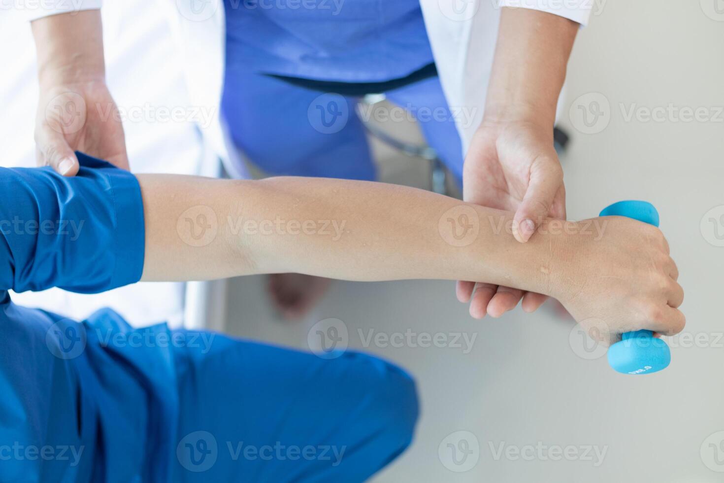 doctor is helping a patient move her muscles after recuperating from a muscle injury and wanting to rehabilitate her to be able to use her normal daily life with continuous physical therapy. photo