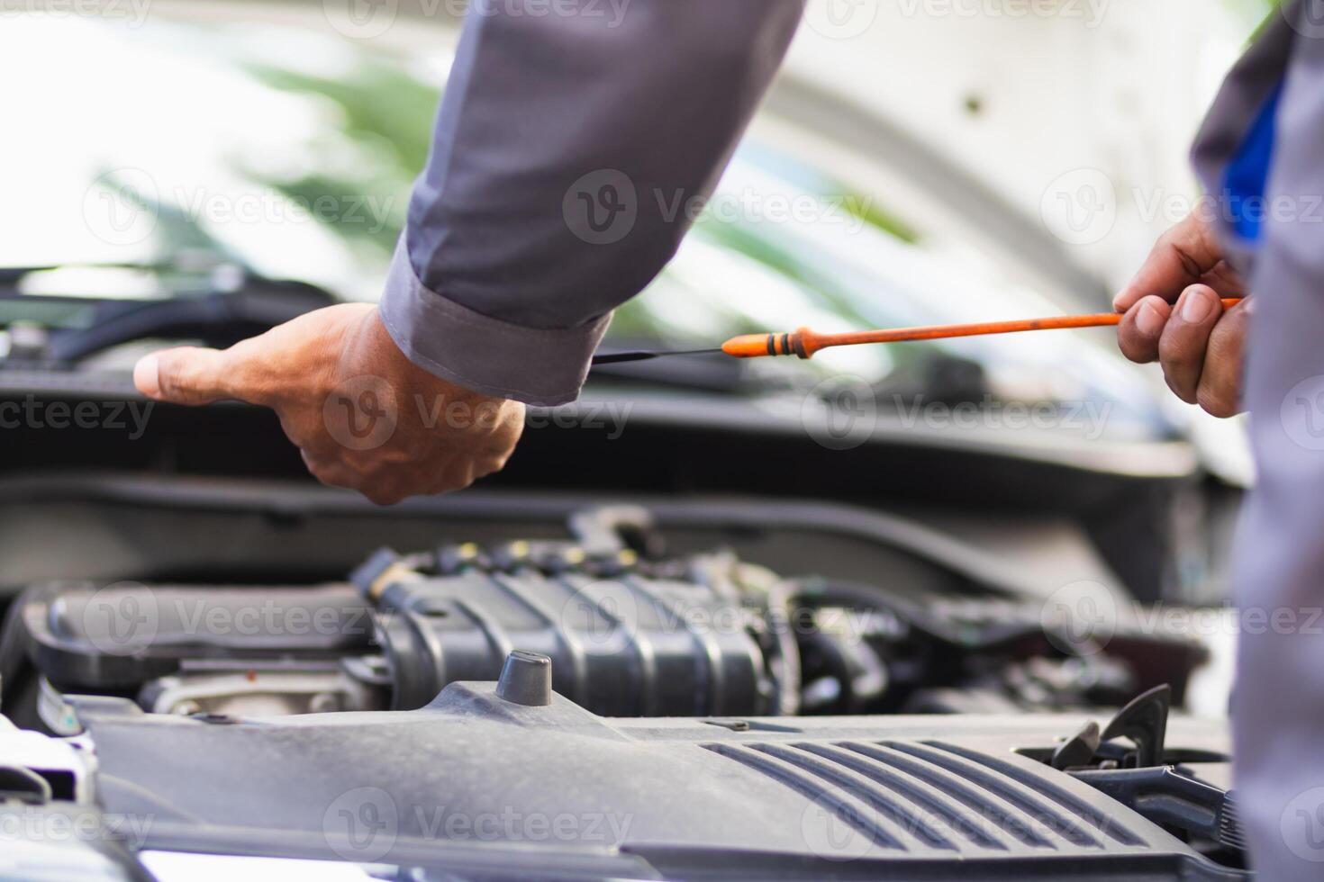 car service center mechanics are checking condition car and engine make sure they are ready use and in perfect condition according center warranty. periodic vehicle inspections for safety in driving. photo