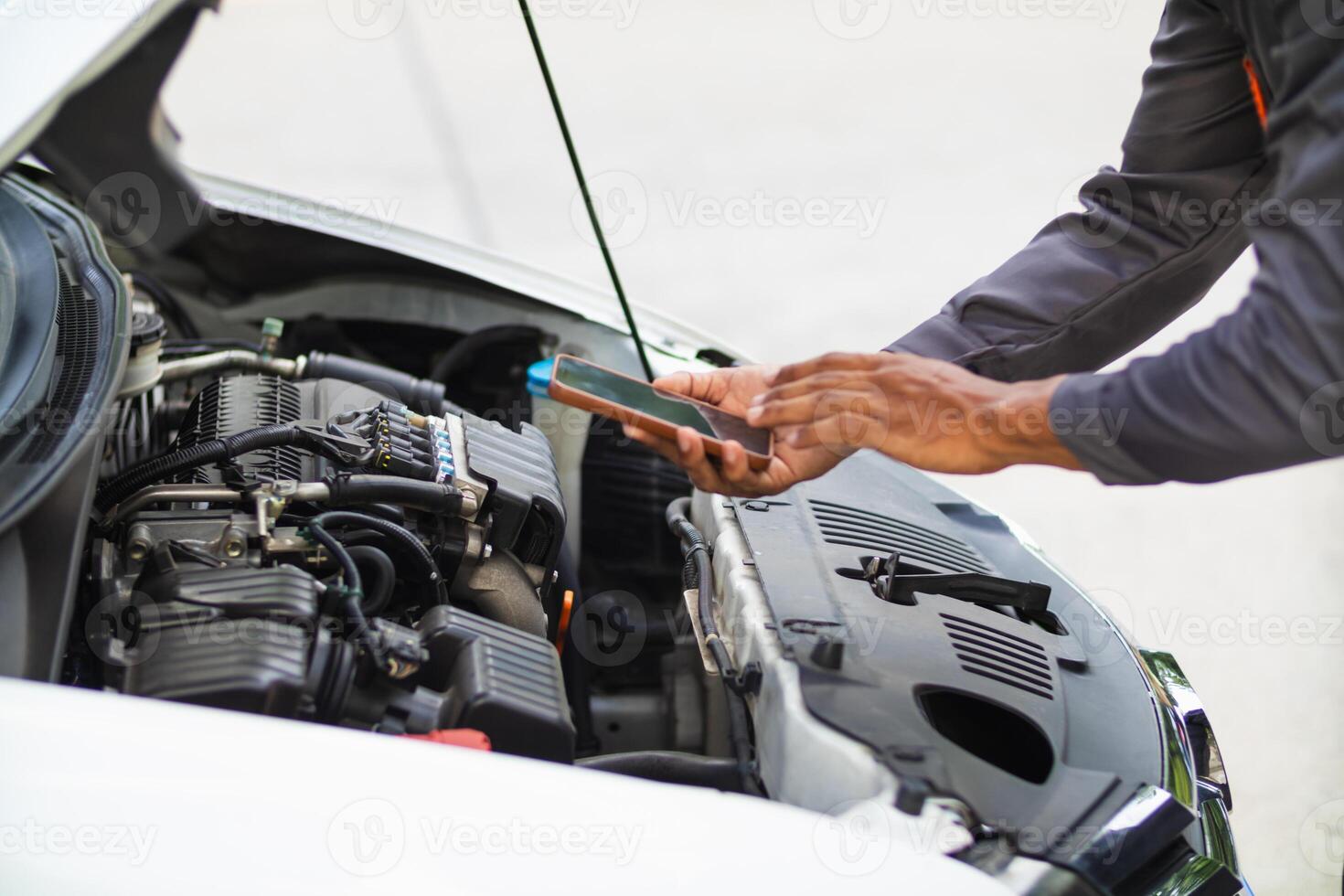 car service center mechanics are checking condition car and engine make sure they are ready use and in perfect condition according center warranty. periodic vehicle inspections for safety in driving. photo