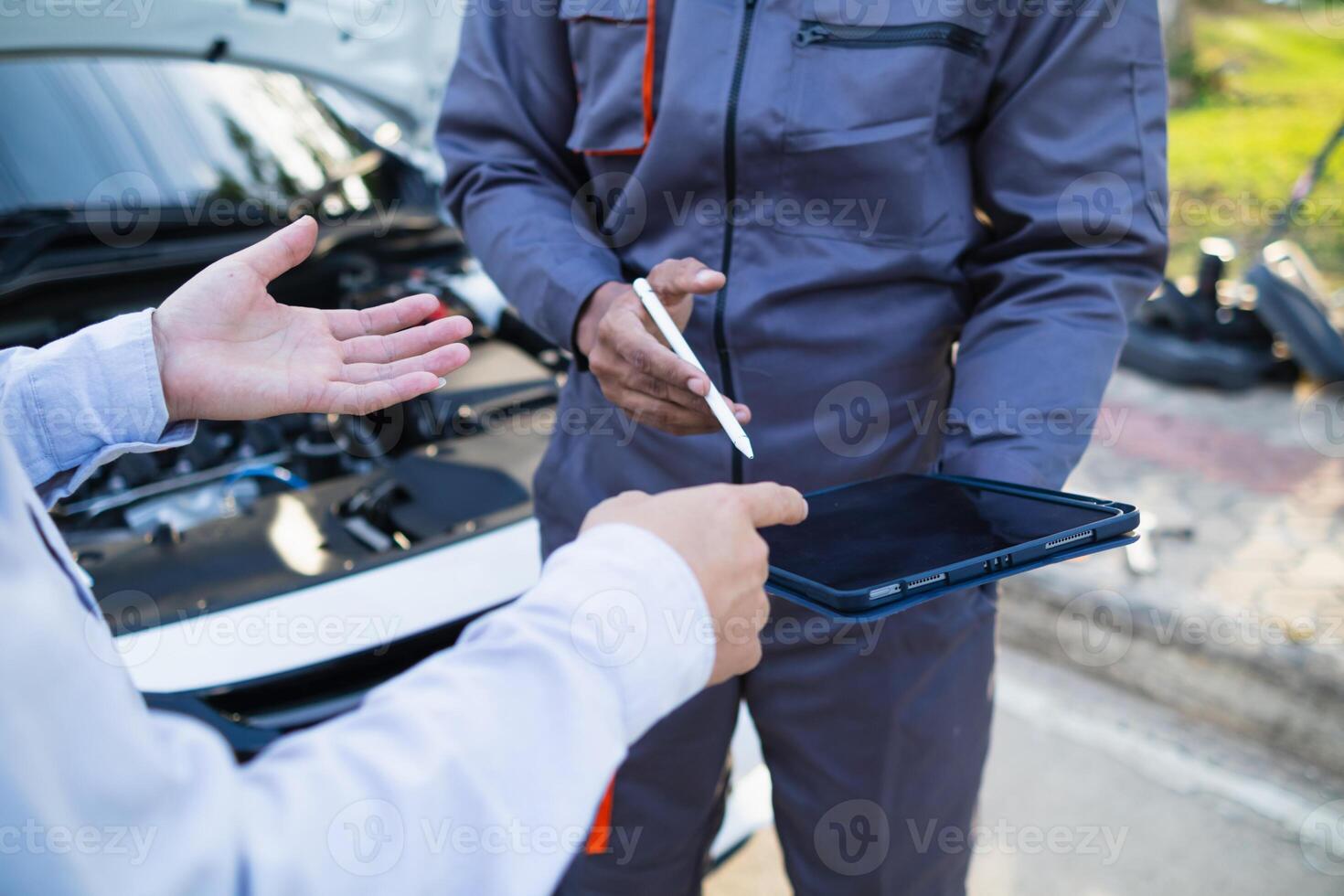 Technicians from service center inspect and assist customers cars that are having problems while traveling build confidence in customers who choose buy car from service center and receive help quickly photo