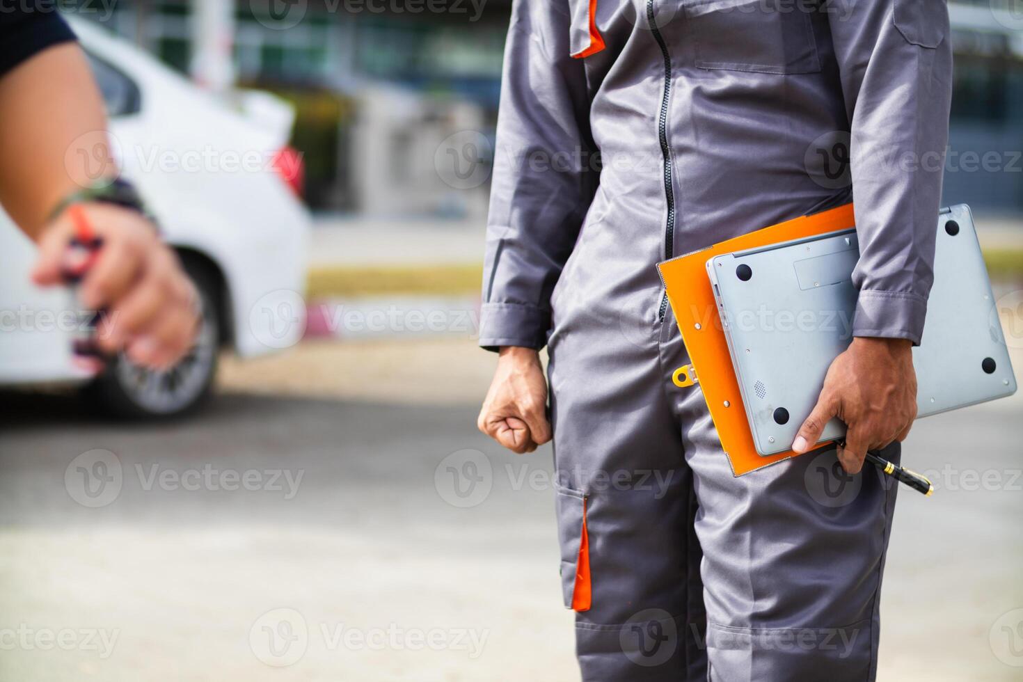 Technicians from service center inspect and assist customers cars that are having problems while traveling build confidence in customers who choose buy car from service center and receive help quickly photo