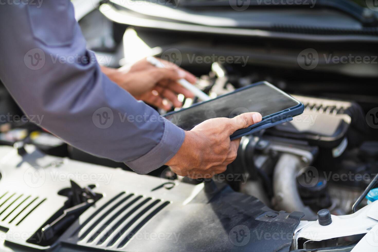 car service center mechanics are checking condition car and engine make sure they are ready use and in perfect condition according center warranty. periodic vehicle inspections for safety in driving. photo