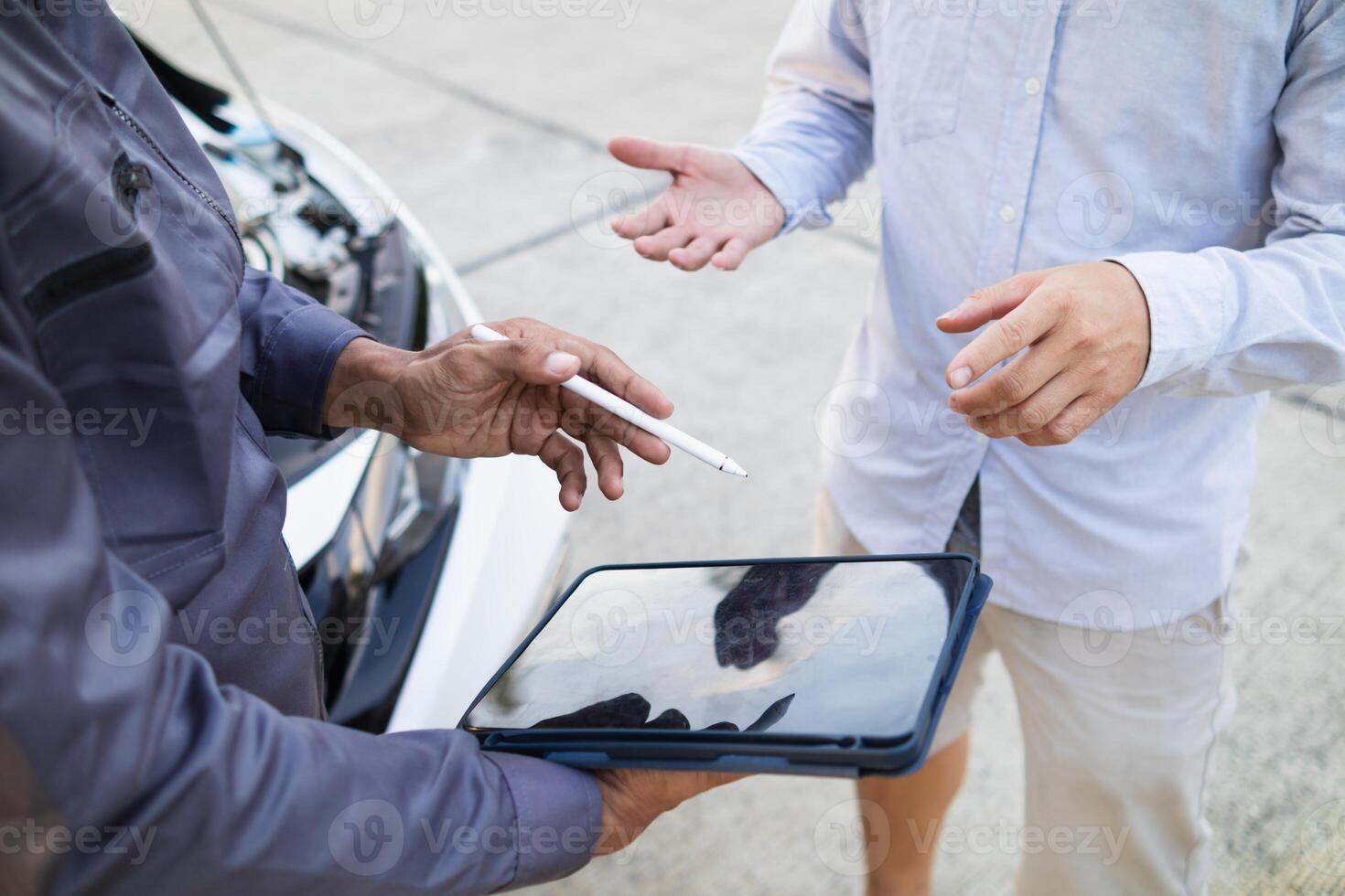 Technicians from service center inspect and assist customers cars that are having problems while traveling build confidence in customers who choose buy car from service center and receive help quickly photo