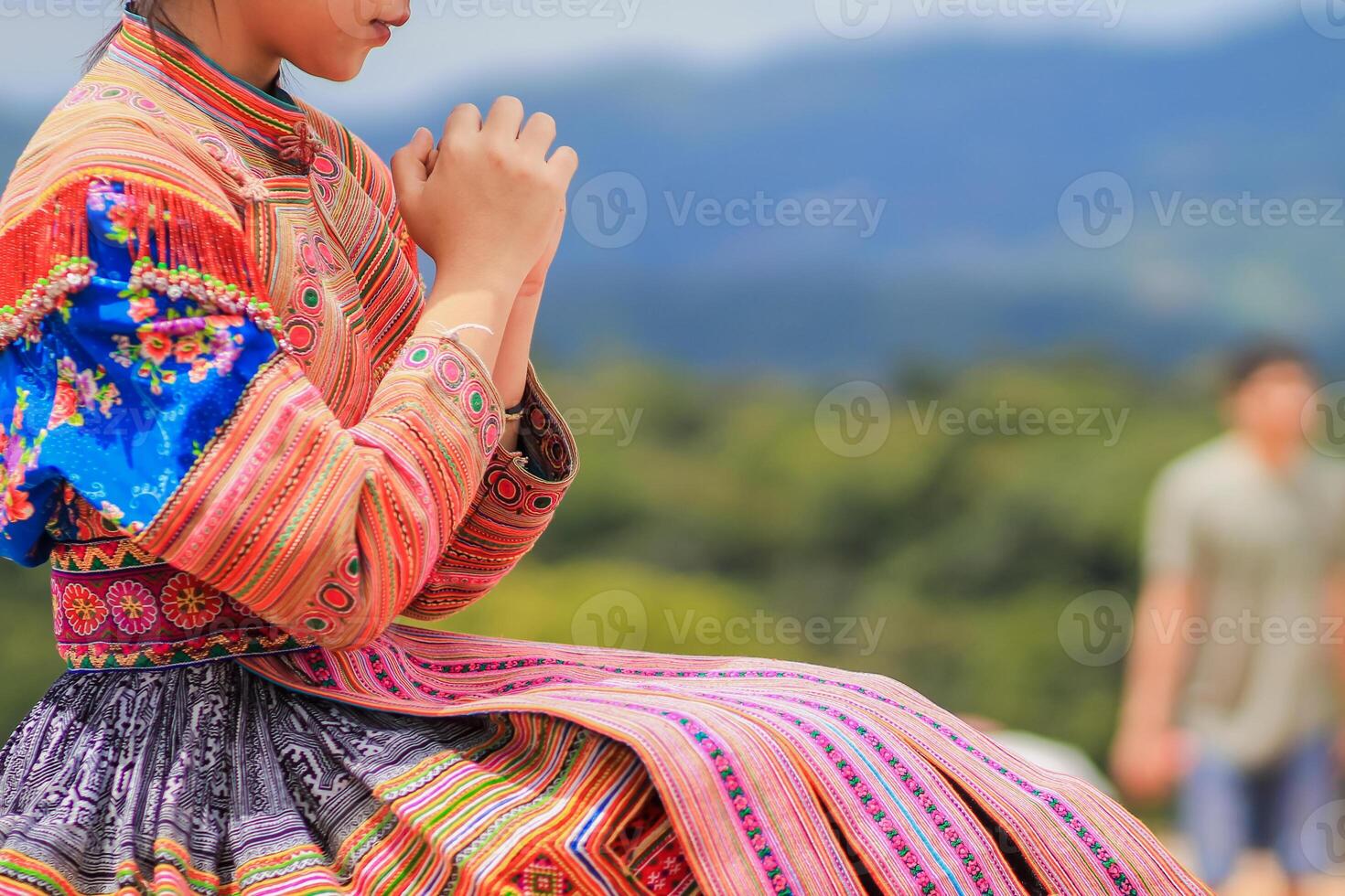 young woman clasped her hands together in prayer asking for forgiveness from God based on her Christian beliefs and faith in God teachings. concept prayer and intercession according beliefs about God photo