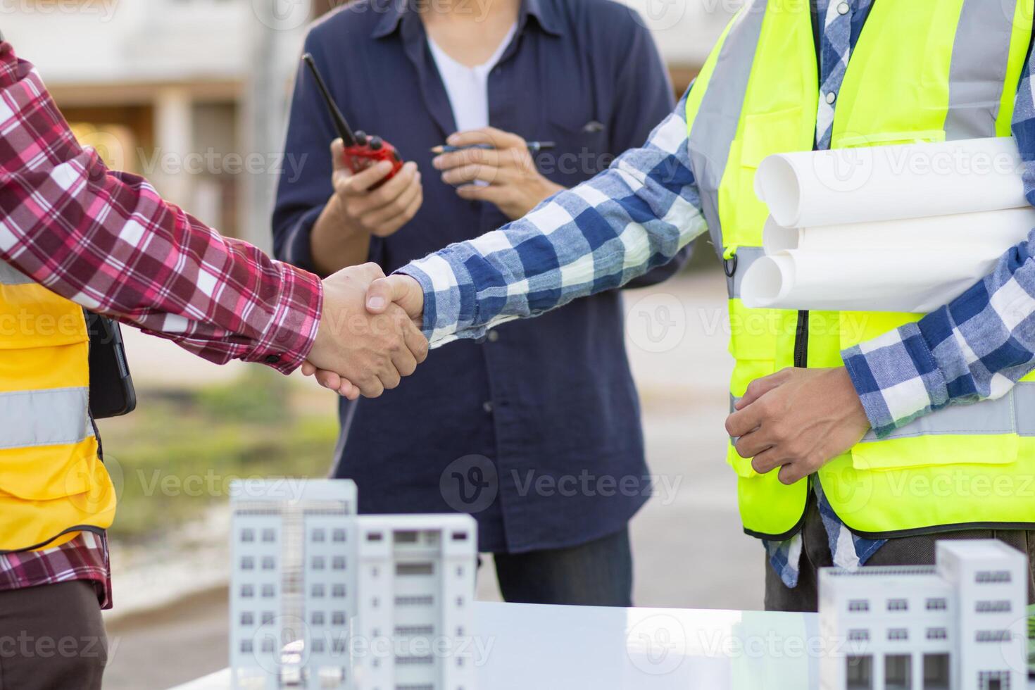 Architects and designers are talking about Construction plans before being delivered to the engineering team and foremen for construction. Audit concept Plans from a team of architects and designers photo