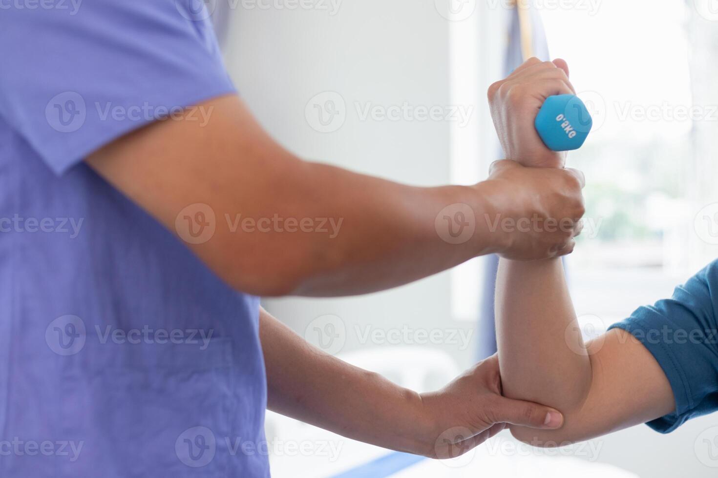 doctor is helping a patient move her muscles after recuperating from a muscle injury and wanting to rehabilitate her to be able to use her normal daily life with continuous physical therapy. photo