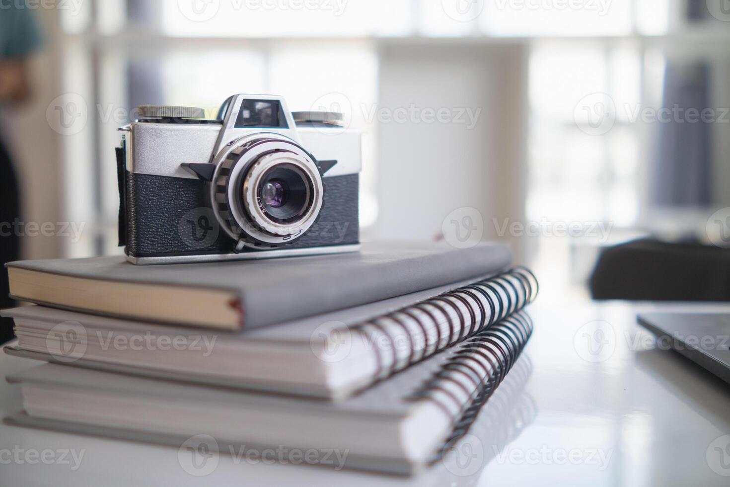 Vintage style film cameras are back in use today because film cameras are classic and have a beautiful shape that gives image unique tone causing some photographers to turn to film cameras. Copy Space photo