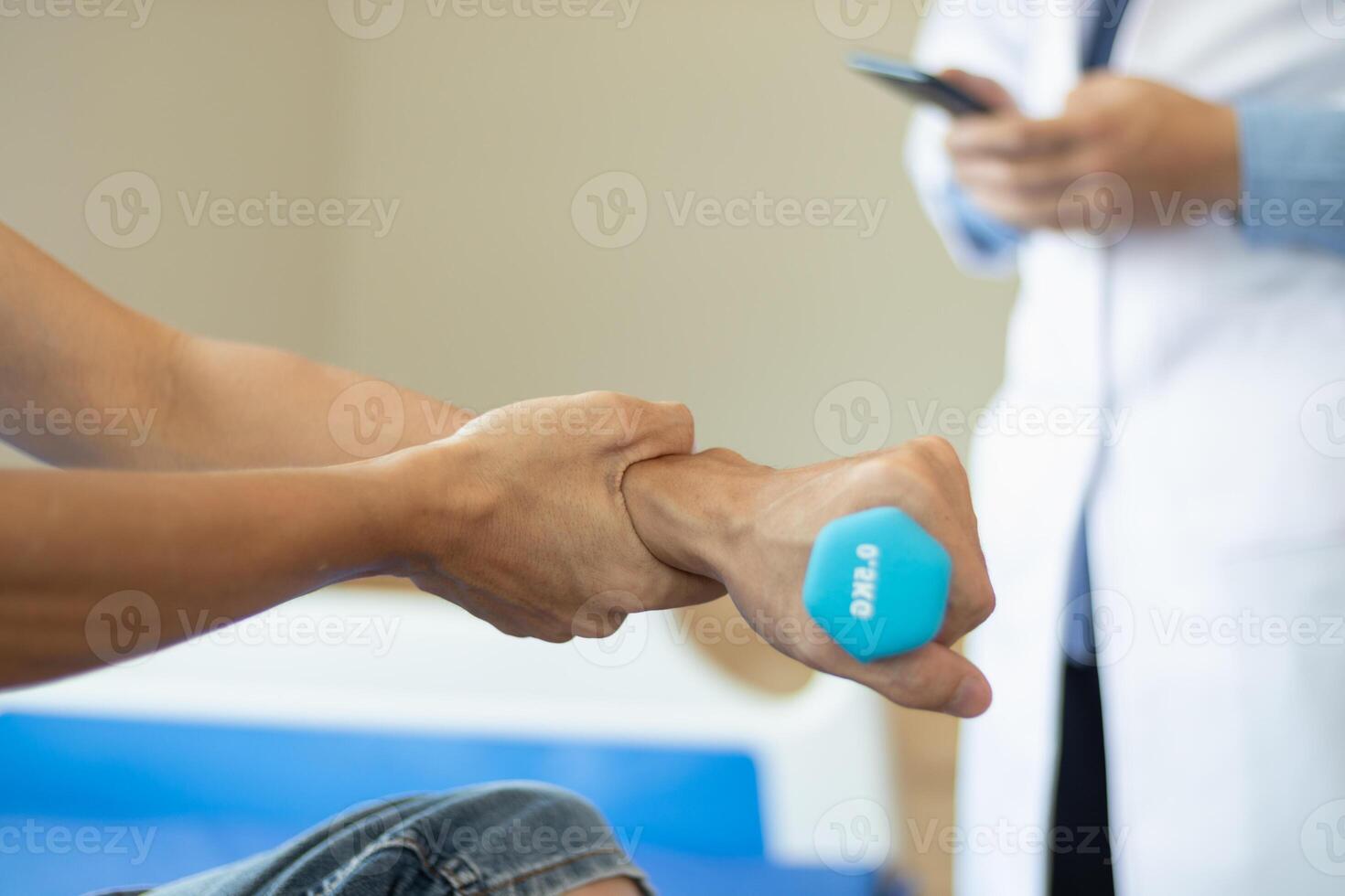 doctor is helping a patient move her muscles after recuperating from a muscle injury and wanting to rehabilitate her to be able to use her normal daily life with continuous physical therapy. photo