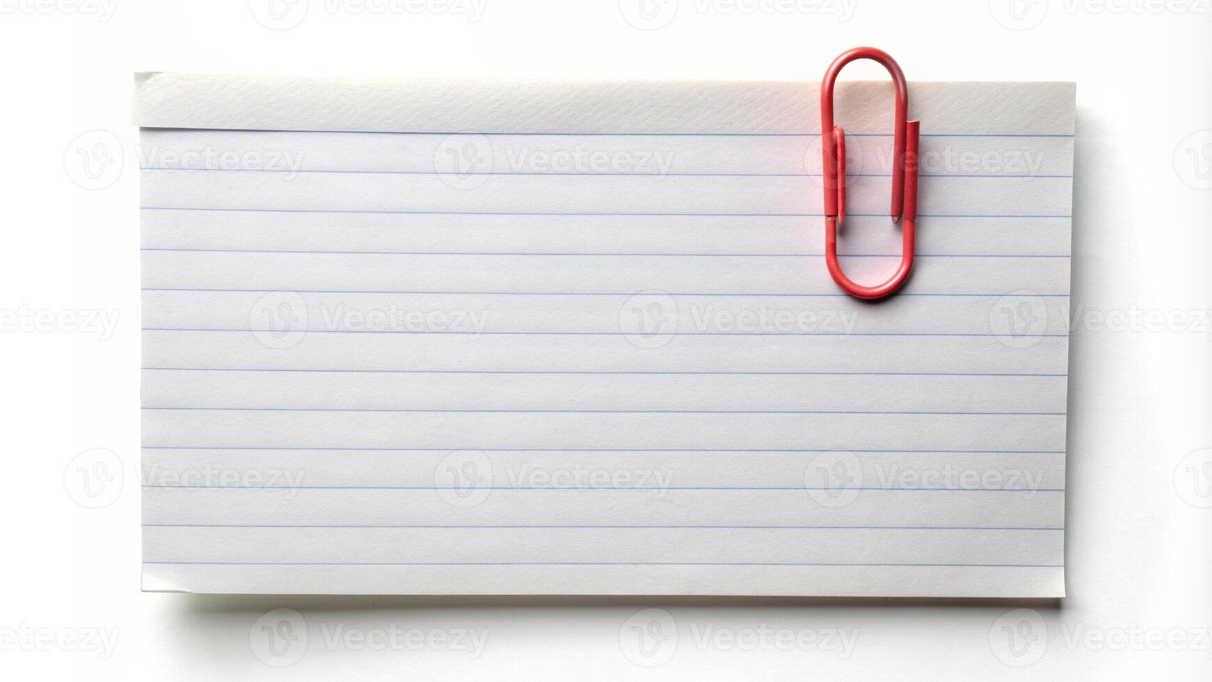 a note pad with a red paper clip on top photo