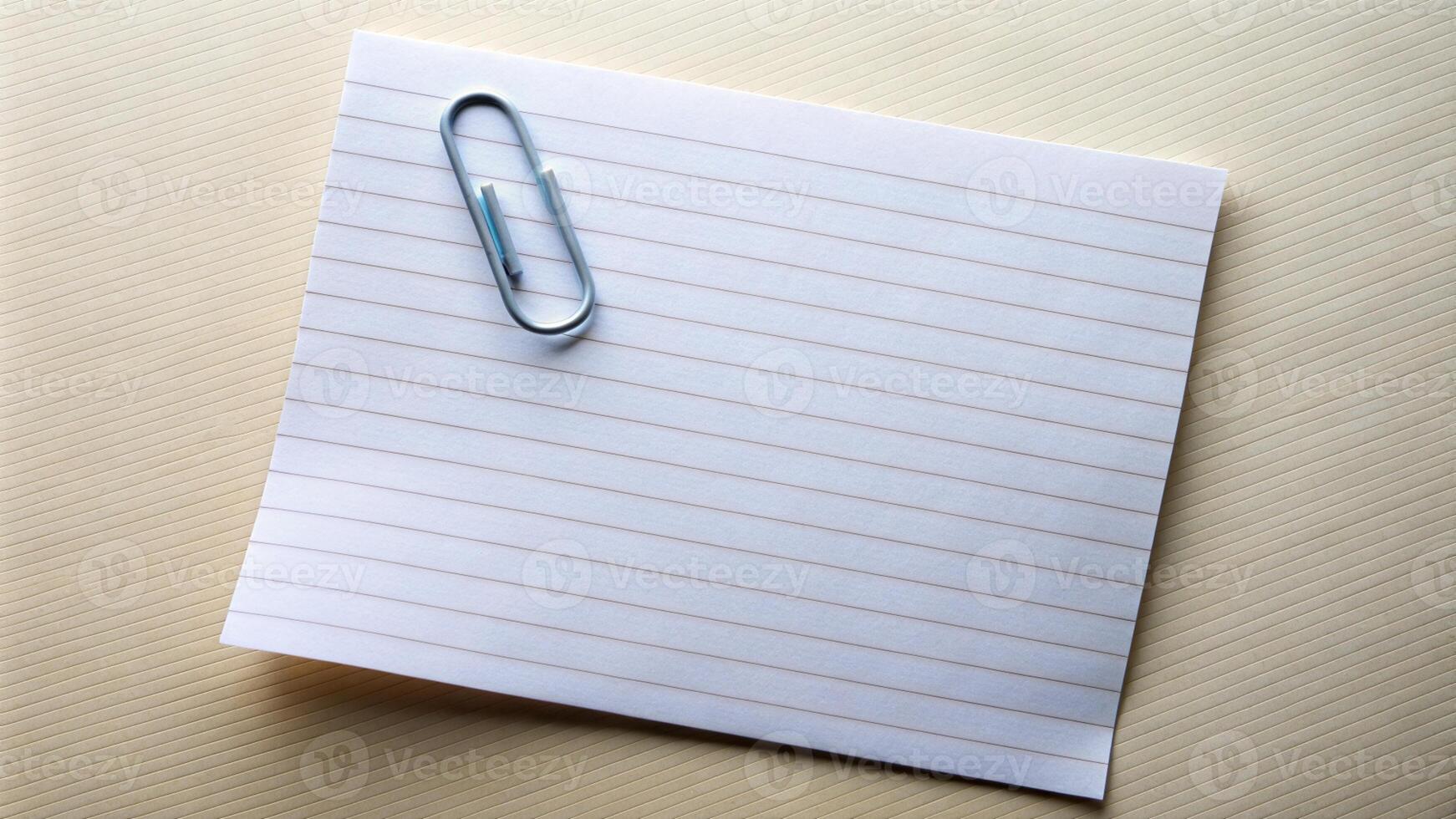 a note paper with a paper clip on top photo