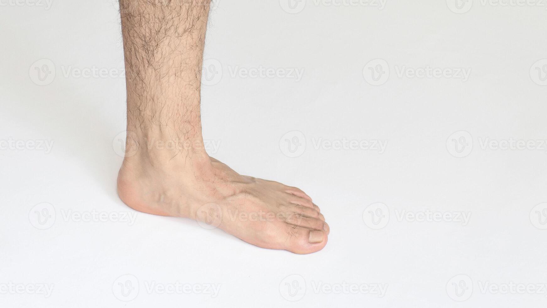 Adult man foot against white background with space for text, view of inner ankle photo