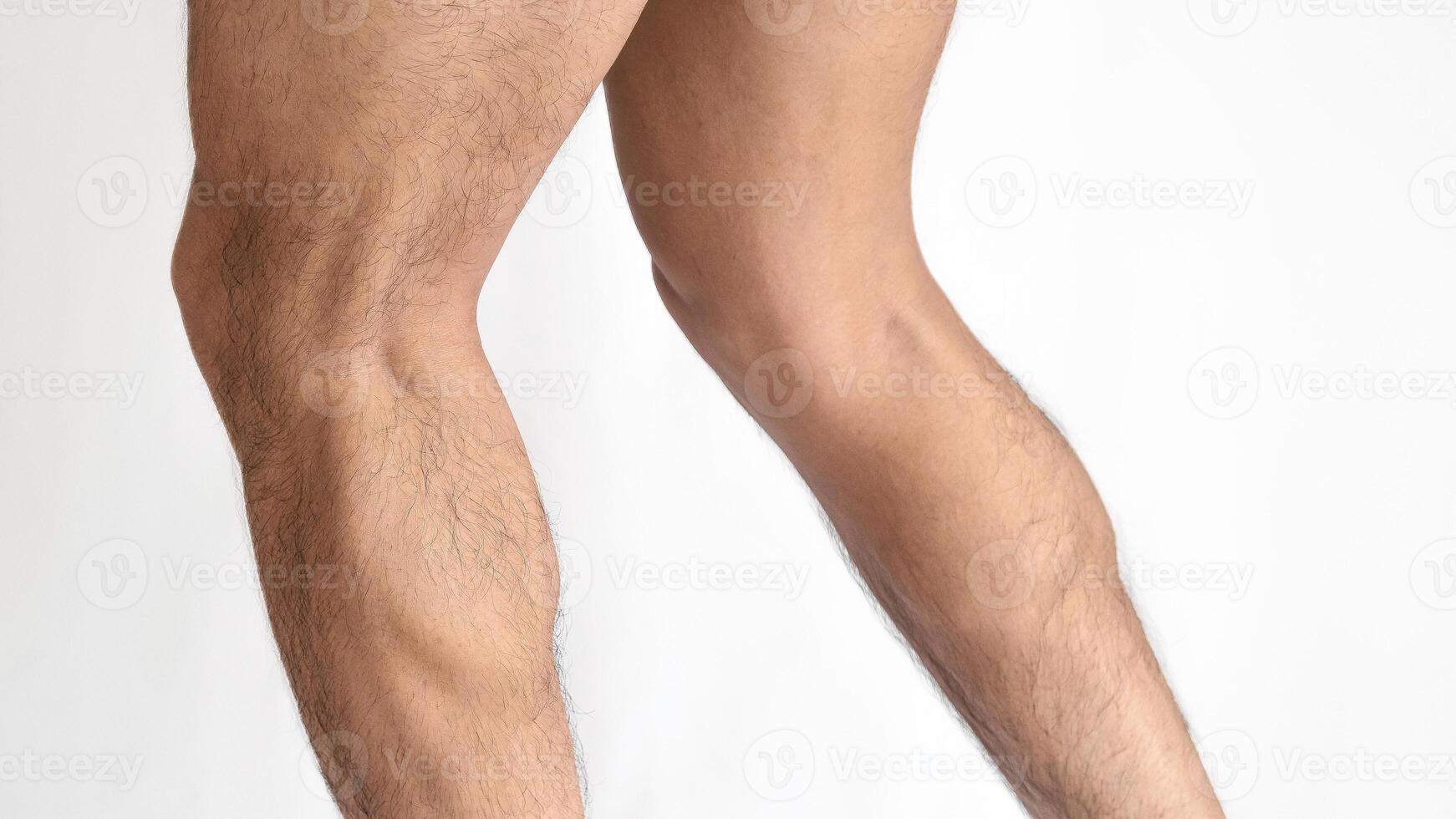 Muscular legs of a man, calves of both feet seen from the side, with a white background and space for text photo