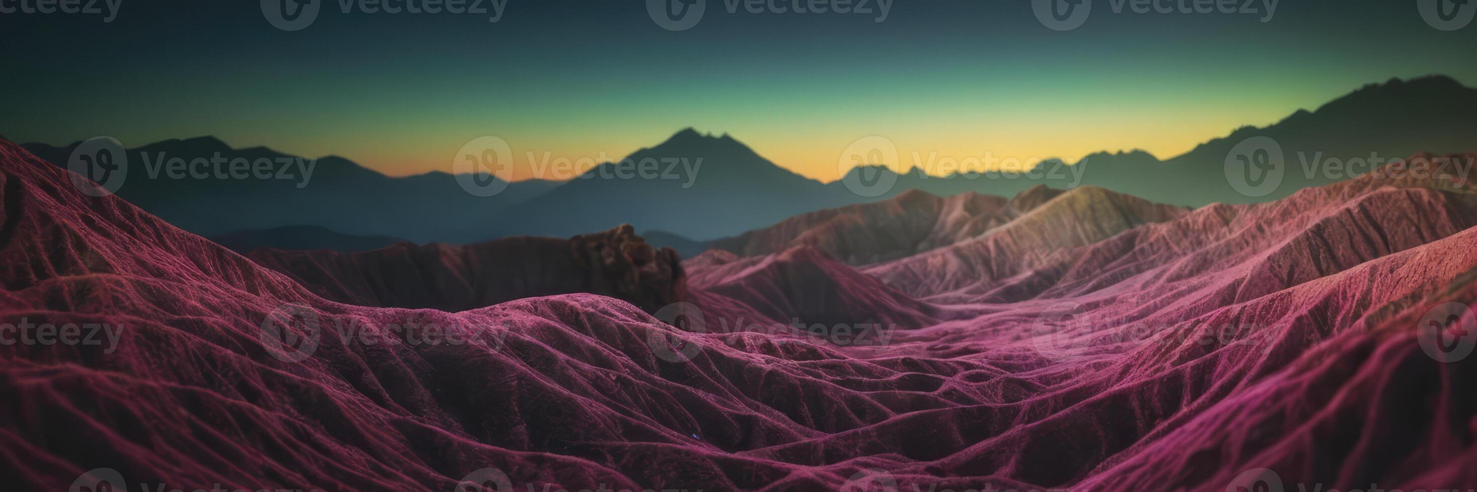 Brightly colored mountains and hills in pink light. Mountains and sunset in the background. photo