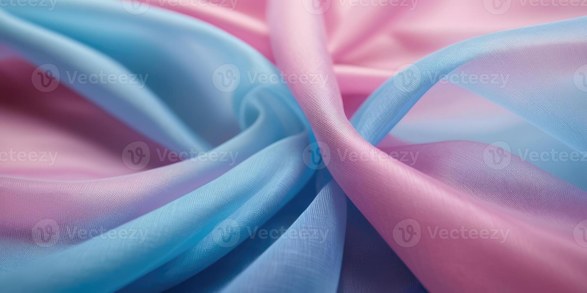 The thin pink and blue fabric sags in folds under its own weight photo