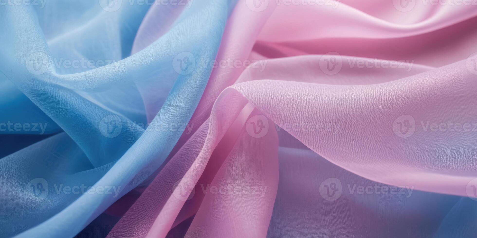 The thin pink and blue fabric sags in folds under its own weight photo