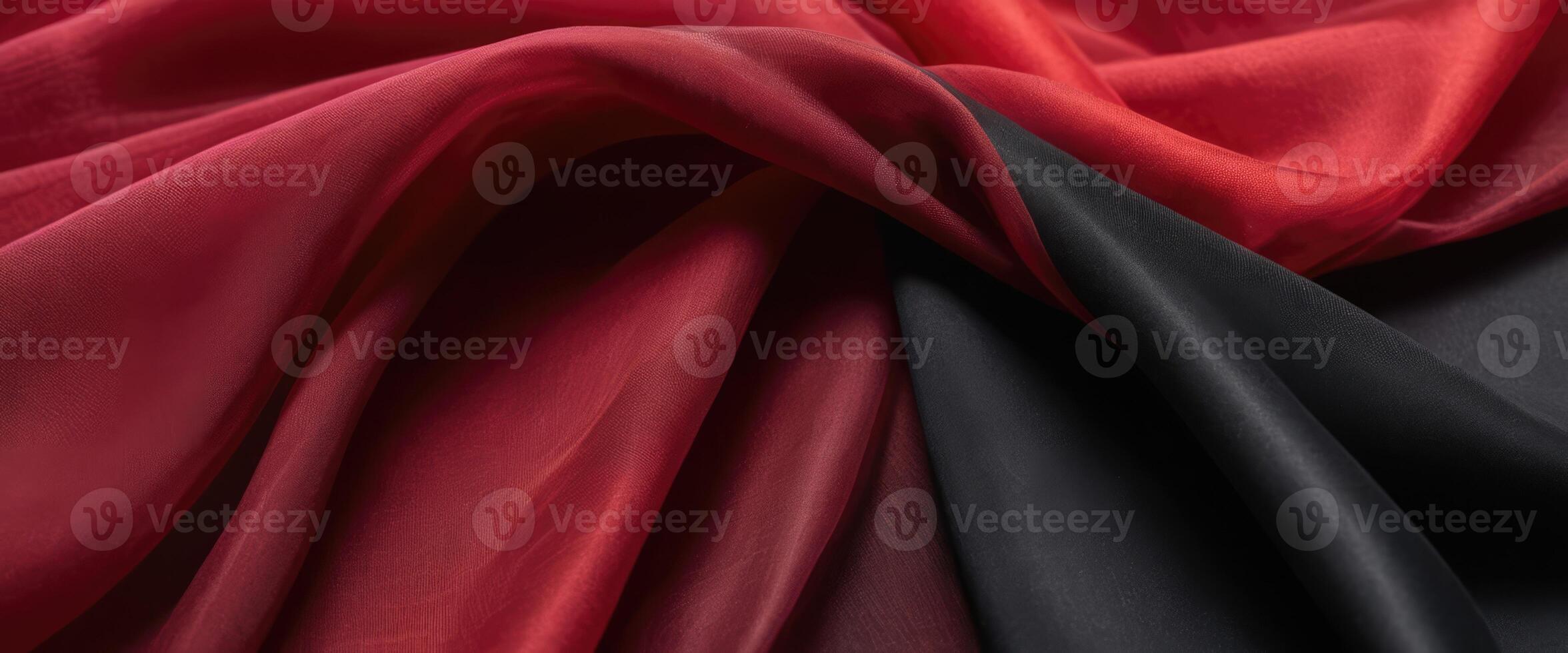 Sensual intertwining folds of black and red fabric photo