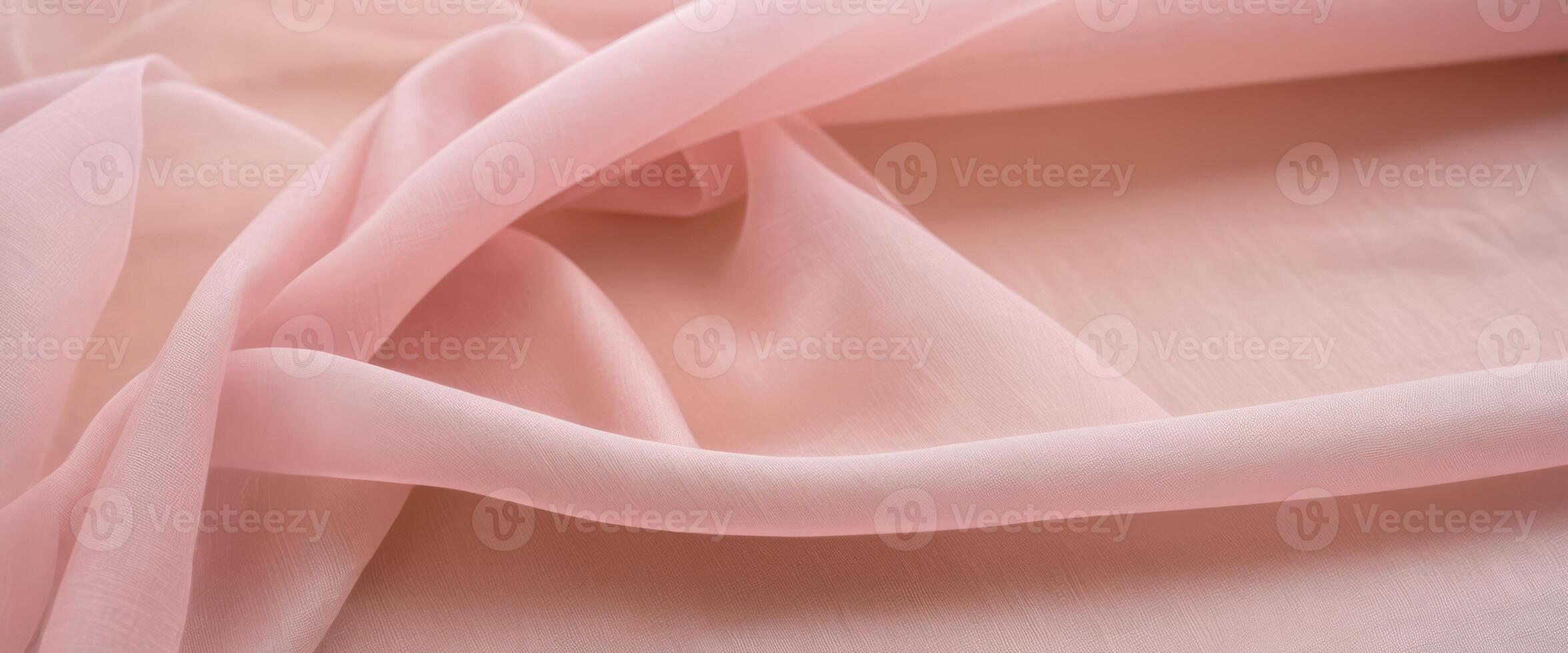 The delicate beige fabric curls into folds photo