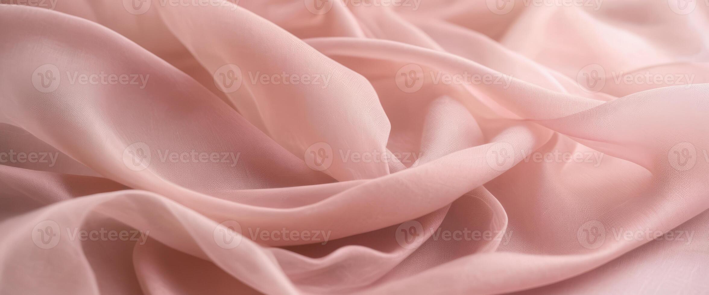 The delicate beige fabric curls into folds photo