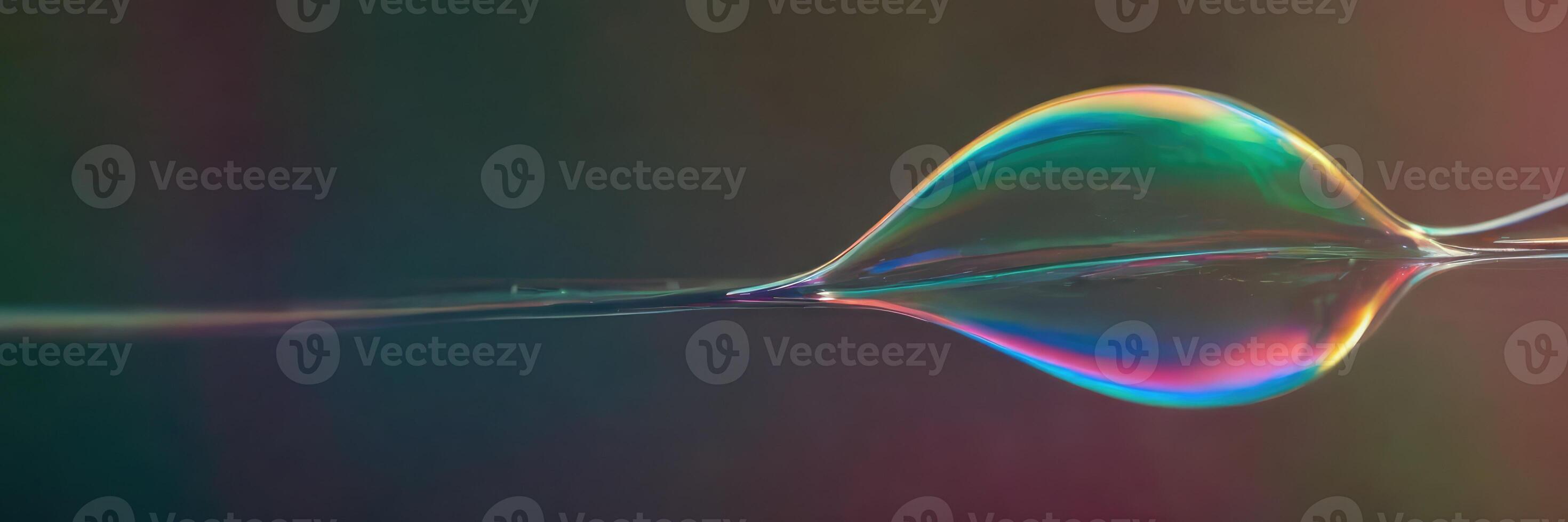 The soap bubble stretched out on another bubble with a reflection. photo