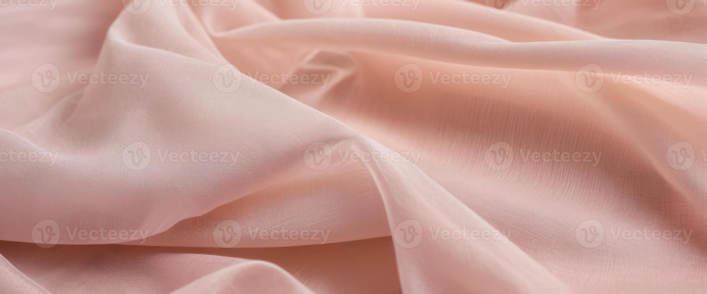 The delicate beige fabric curls into folds photo