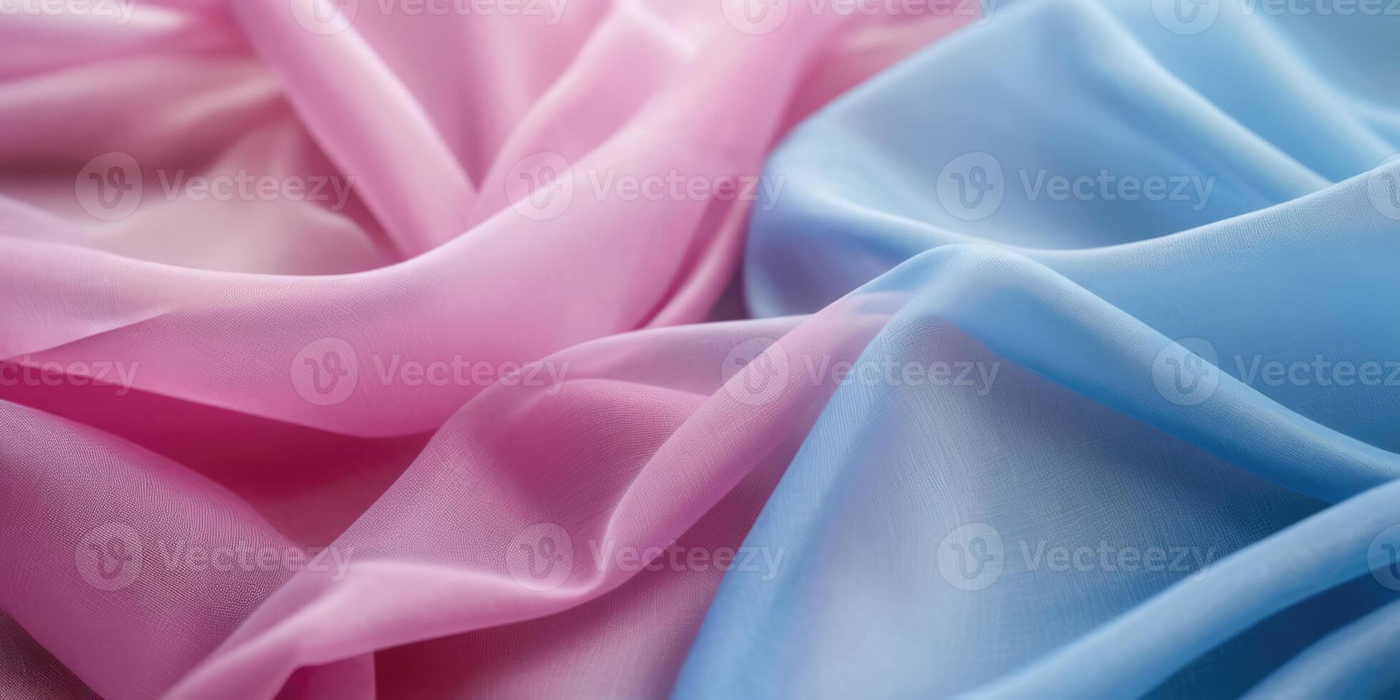 The thin pink and blue fabric sags in folds under its own weight photo