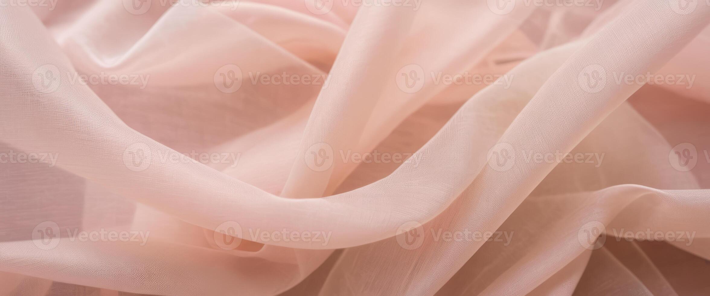 The delicate beige fabric curls into folds photo