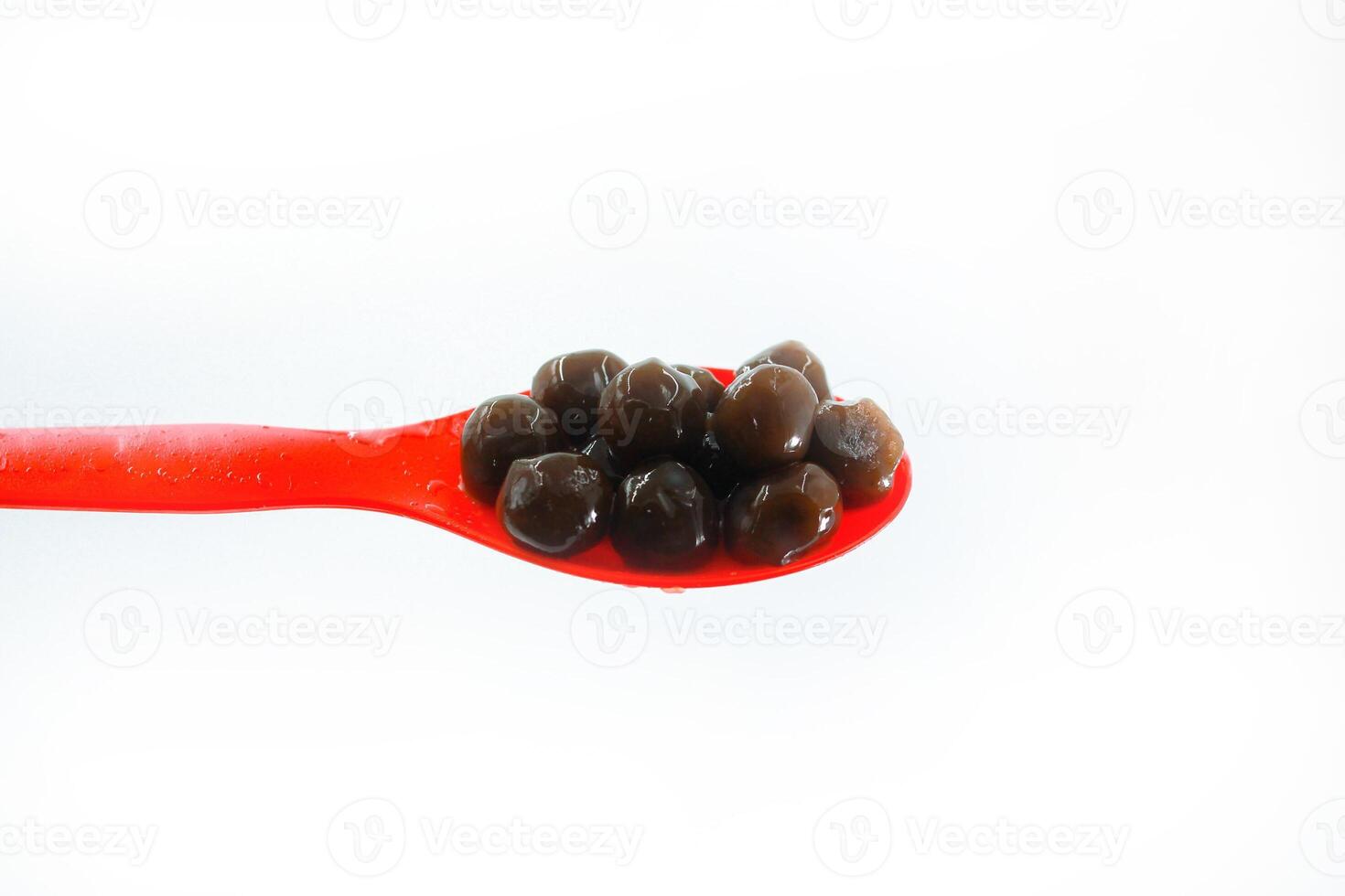 some bubble tea pearls in a red spoon photo