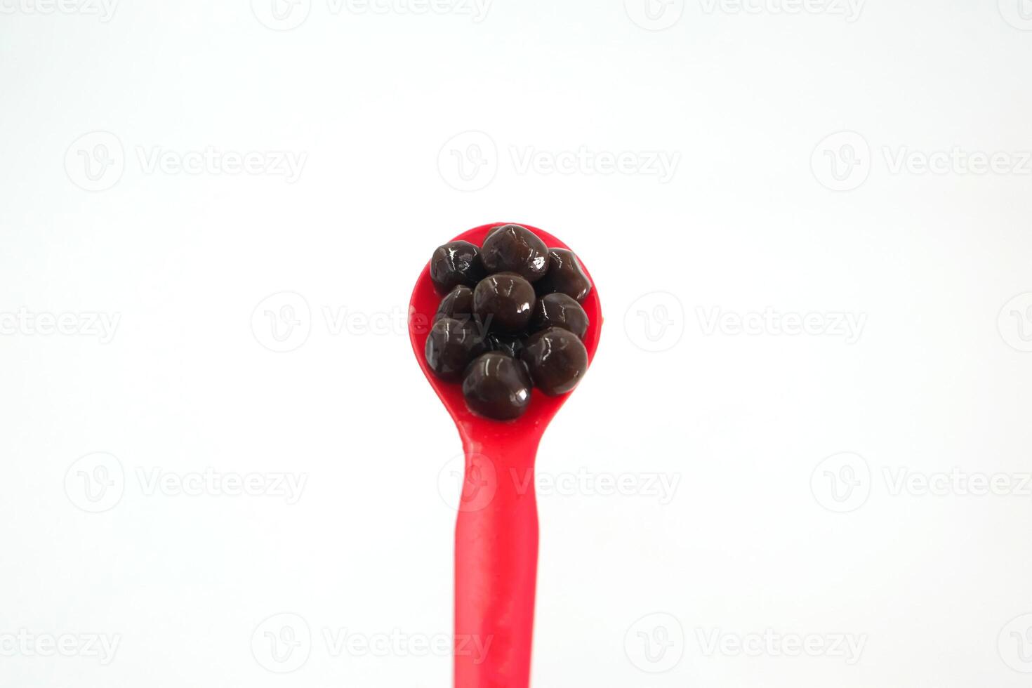 bubble tea pearls in a red spoon photo