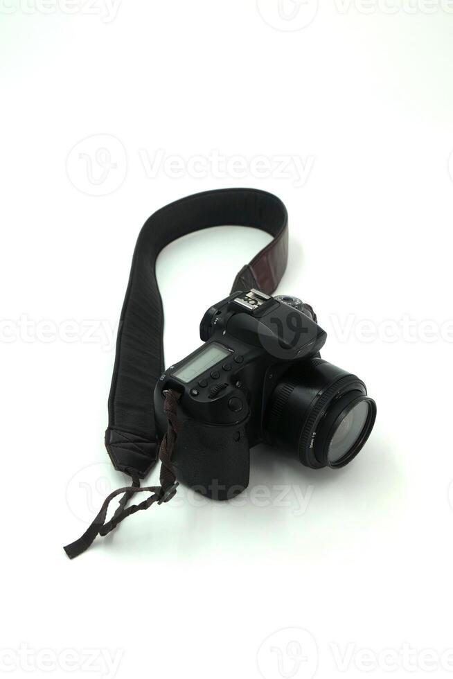 Black digital SLR camera in a white background photo