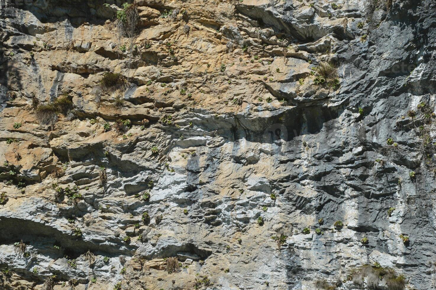 Fragment of a mountain, rocks, stone texture, natural background. photo