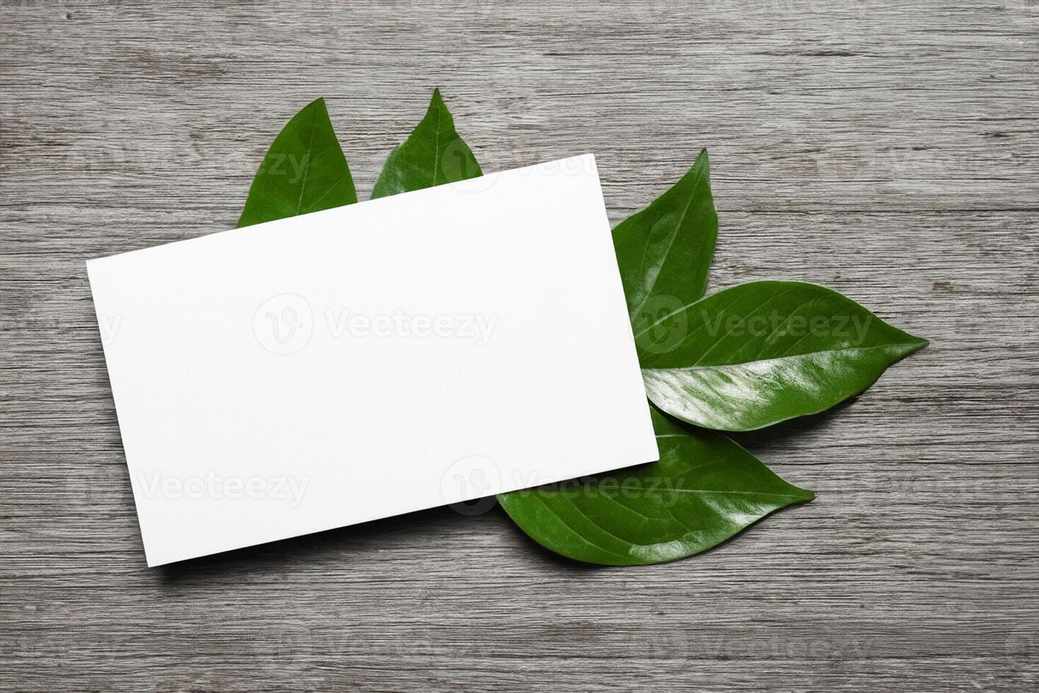 Wooden Background Combined with Leaves Enhances the Elegance of Paper, Creating a Stunning Composition Inspired by Nature's Harmony photo