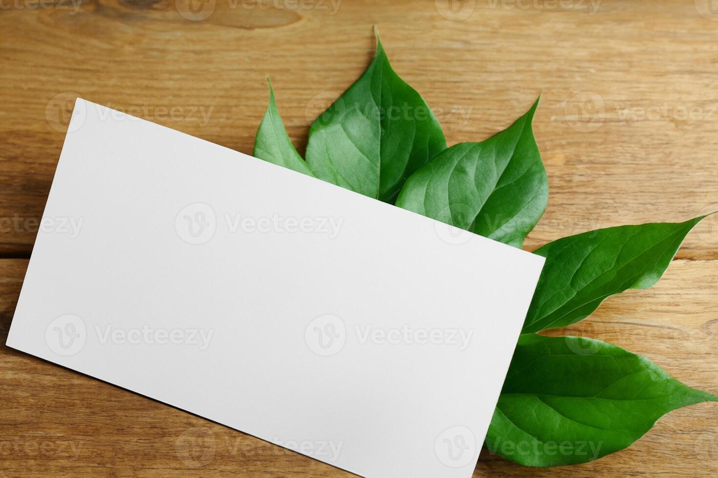 Wooden Background Combined with Leaves Enhances the Elegance of Paper, Creating a Stunning Composition Inspired by Nature's Harmony photo
