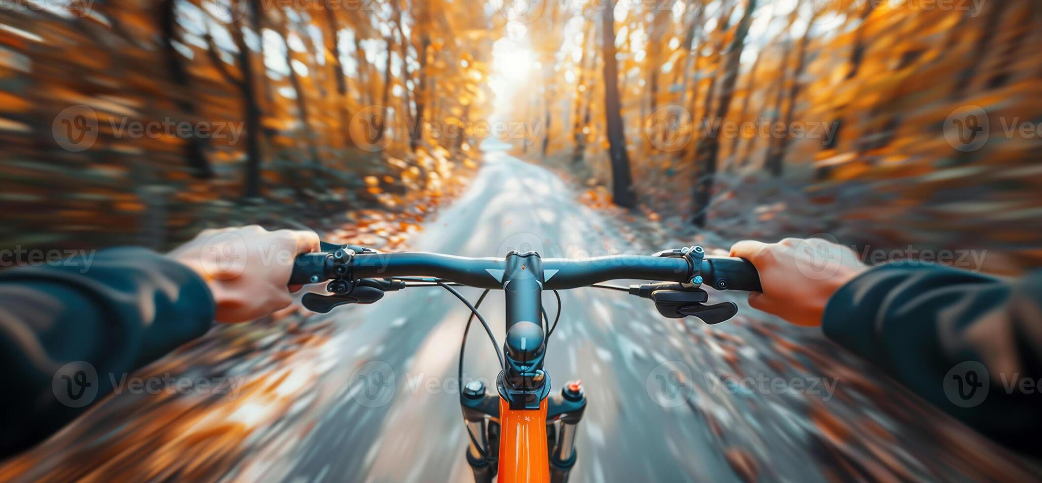 Bicycle Riding Photo. Close Up of Hands on Bicycle Handlebar in the Autumn Forest. Blurred Forest Background. Sunny Day. High-Speed Bicycle Riding Background. photo