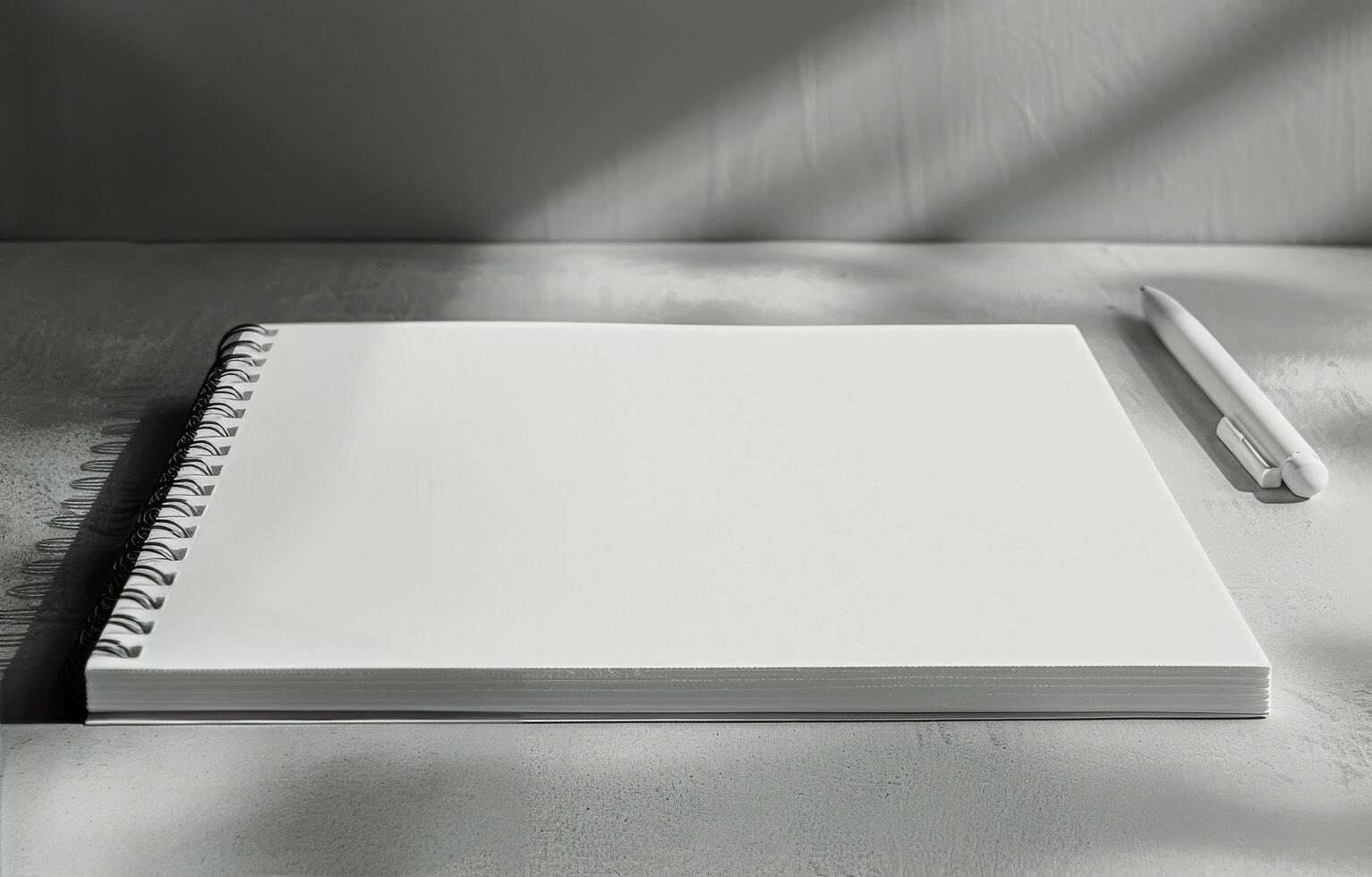 Notebook and Pen on Desk photo