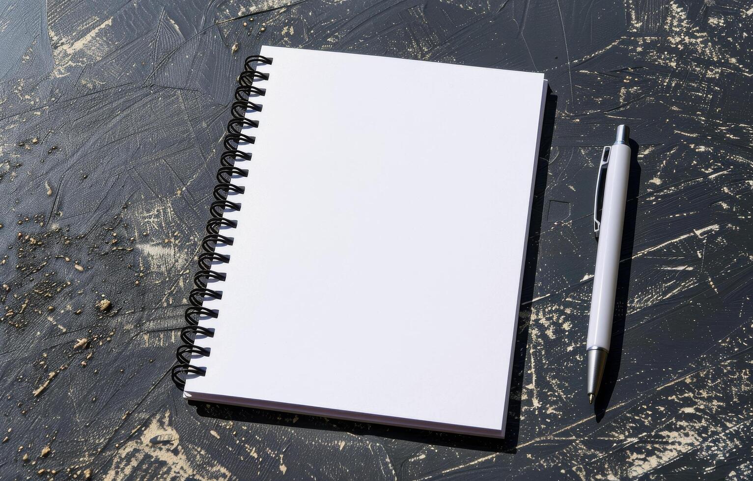 Notebook and Pen on Desk photo