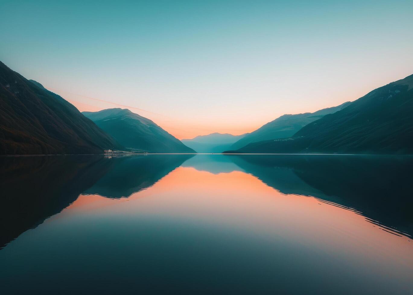 Majestic Mountains Overlooking Serene Body of Water photo