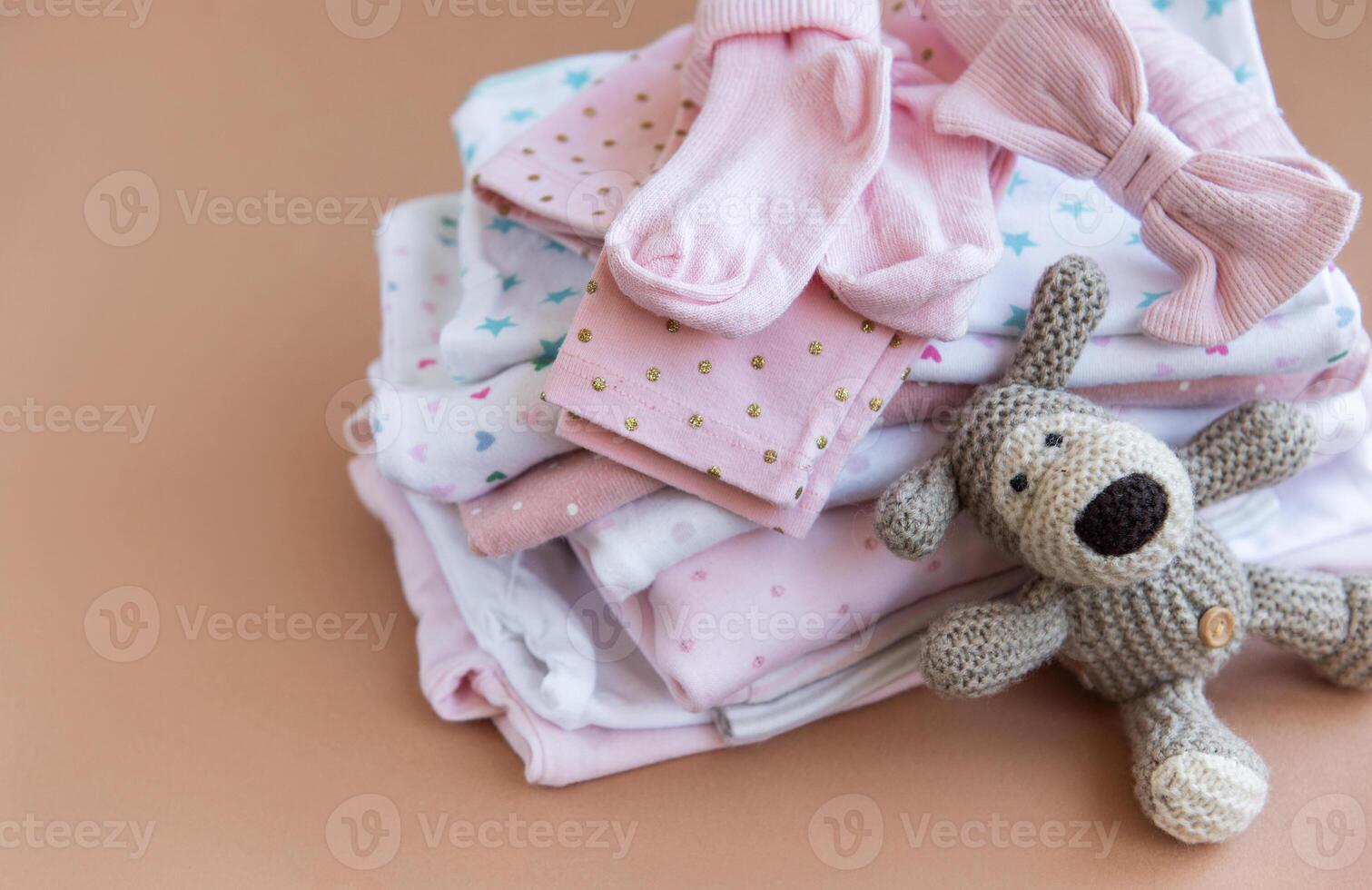 Stack of Baby bodysuits. photo