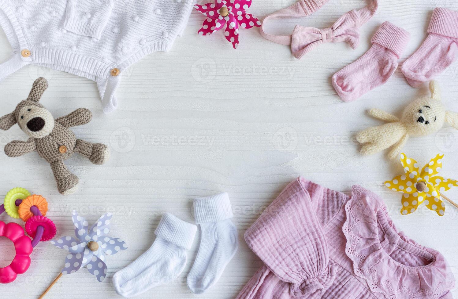 Set of pink clothes and accessories for newborn baby. photo