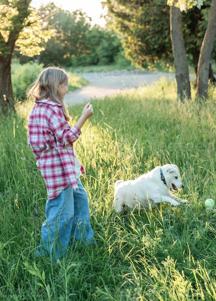 A child with a dog in nature photo